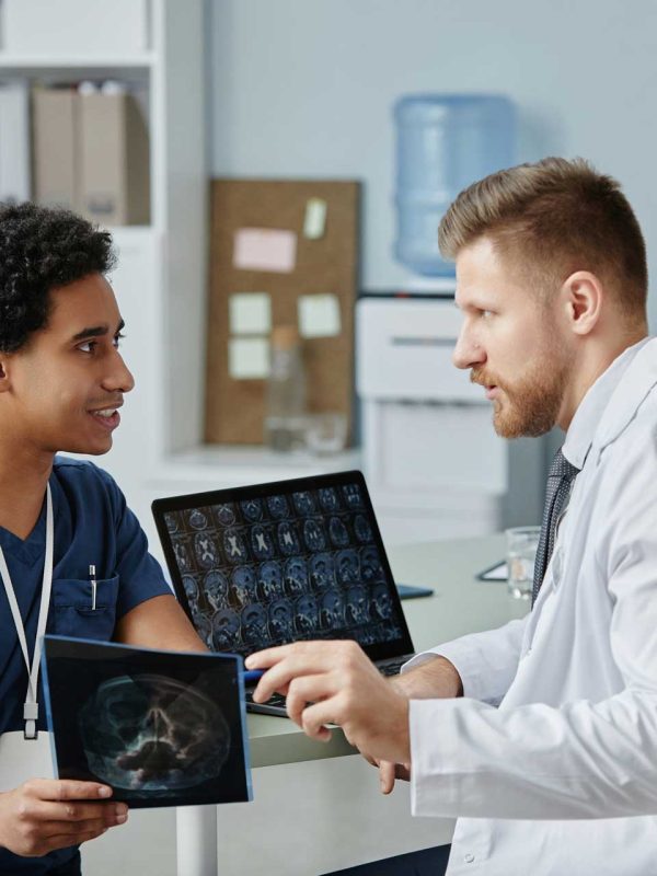 two-male-doctors-discussing-x-ray-images-working-i-2023-11-27-04-54-56-utc
